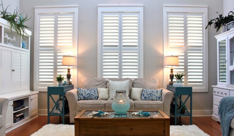 Destin designer sunroom with white shutters 
